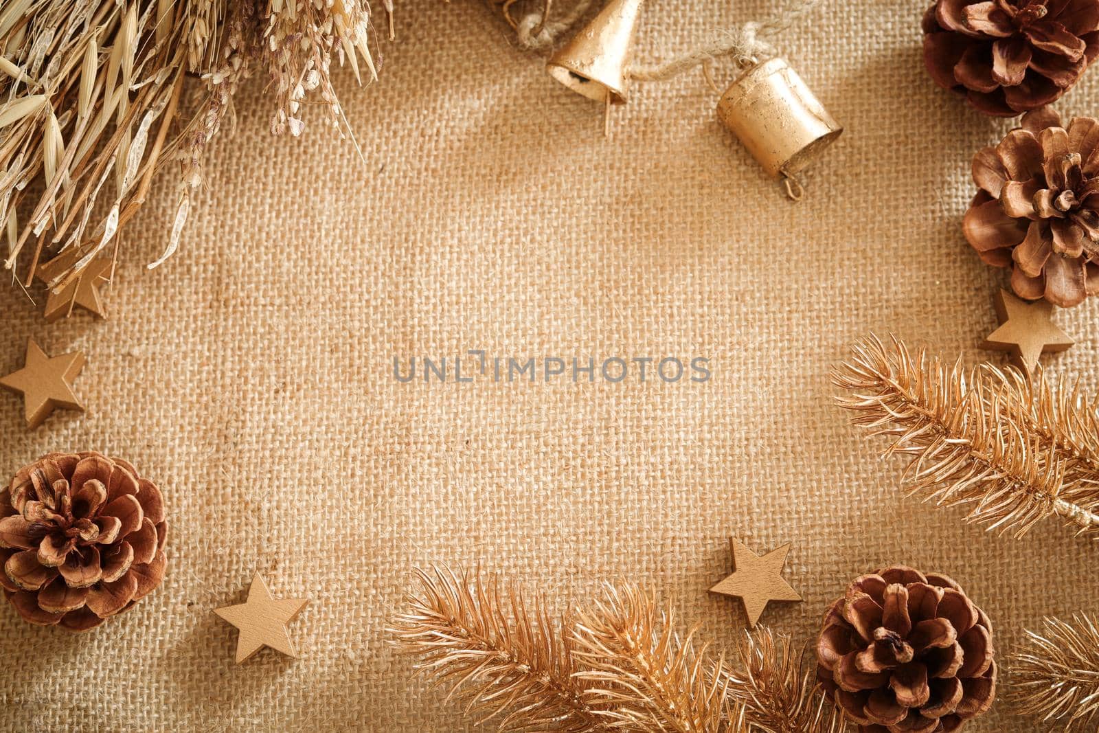 Christmas composition with natural colors and materials. Xmas background, mockup. Decoration elements, pine cones. Free space for text, copy space. Flat lay, top view