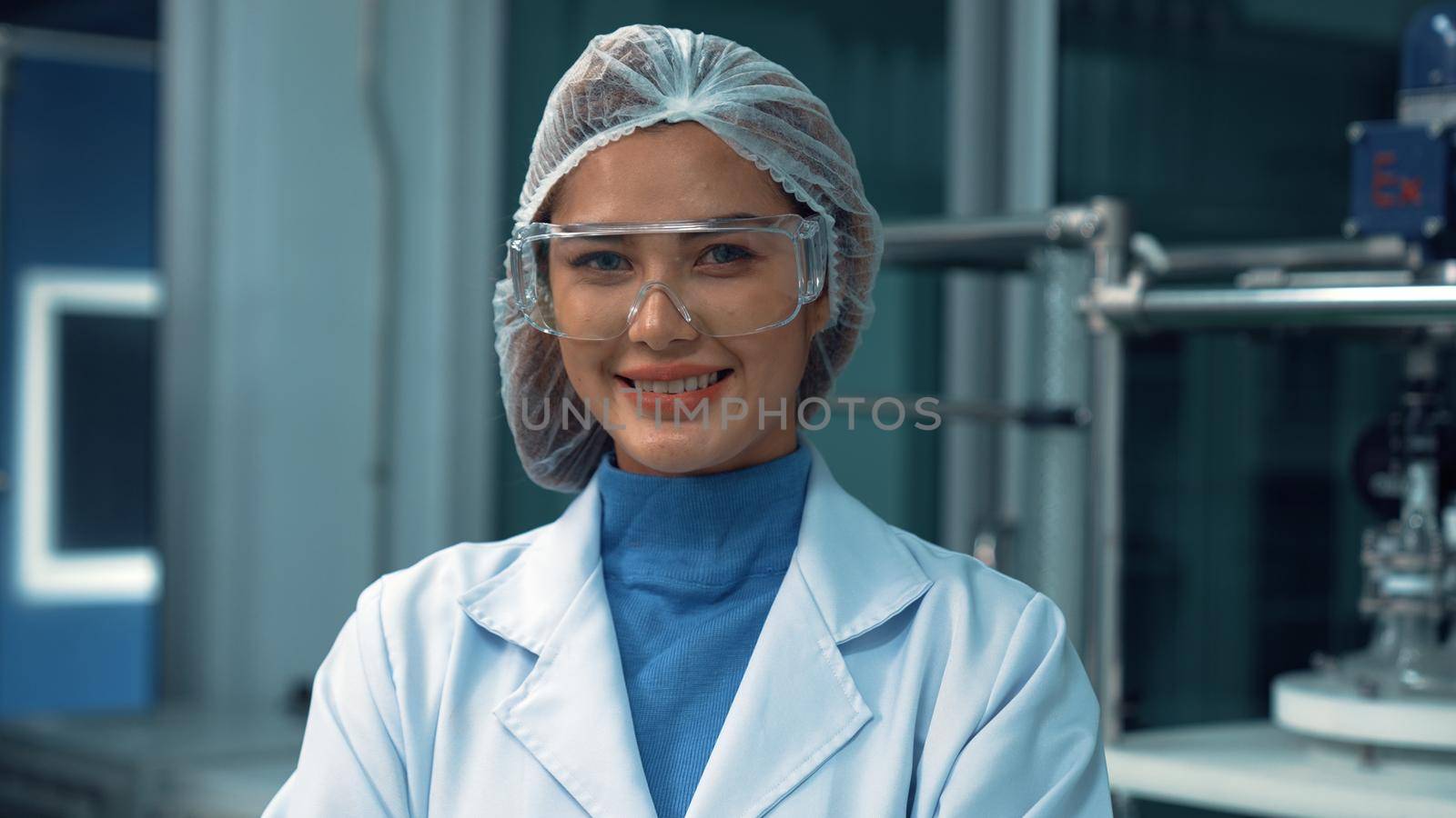 Portrait of a woman scientist in uniform working in curative laboratory for chemical and biomedical experiment