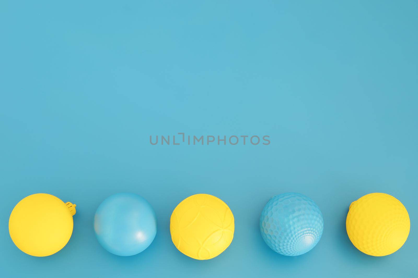 Blue and yellow Christmas composition. Trendy Xmas background, mockup. Modern design. Free space for text, copy space. Flat lay, top view by creativebird