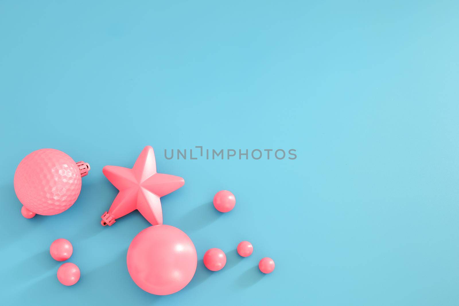 Pink Christmas composition on the blue background. Trendy Xmas background, mockup. Modern design. Free space for text, copy space. Flat lay, top view. by creativebird