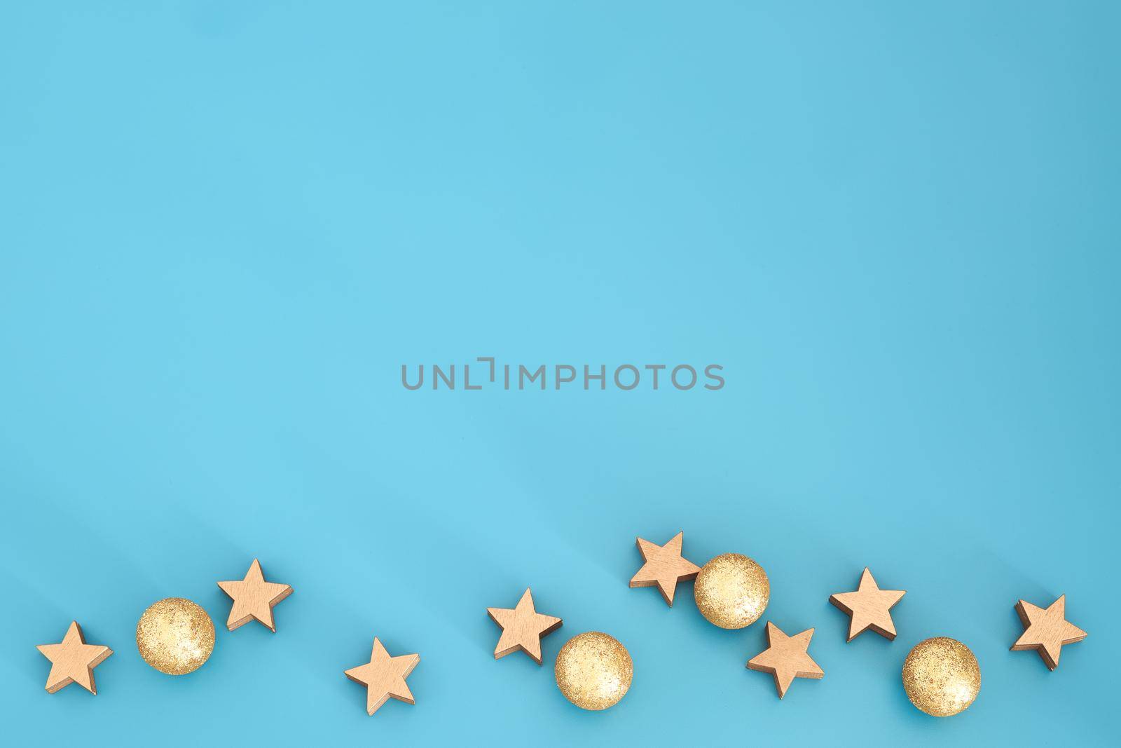 Blue Christmas composition with stars. Trendy Xmas background, mockup. Modern design. Free space for text, copy space. Flat lay, top view