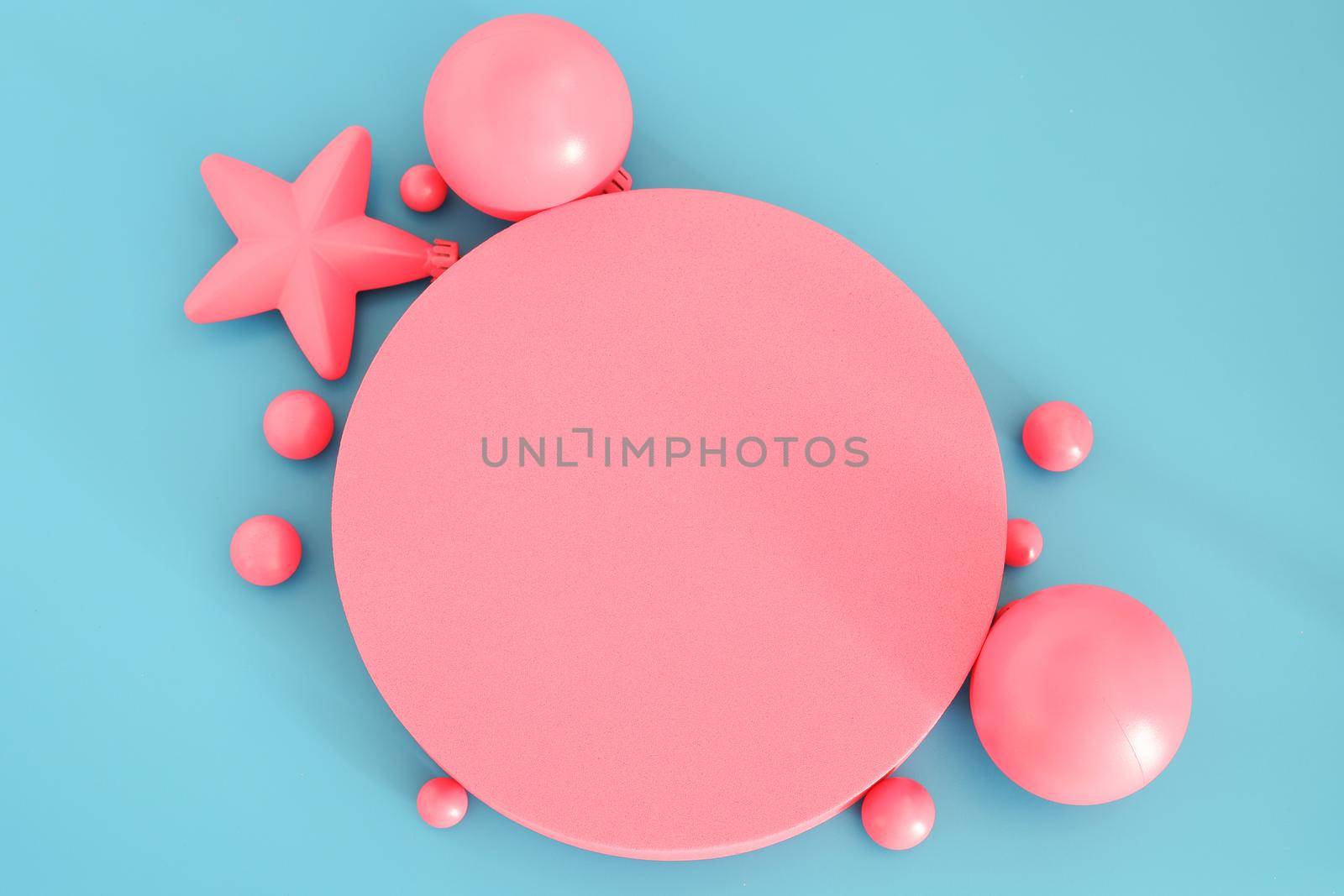 Pink Christmas composition on the blue background. Trendy Xmas background, mockup. Modern design. Free space for text, copy space. Flat lay, top view