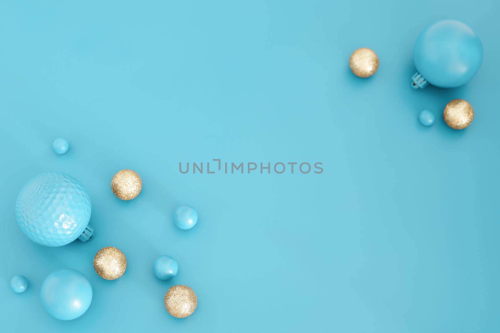 Blue Christmas composition with gold details. Trendy Xmas background, mockup. Modern design. Free space for text, copy space. Flat lay, top view