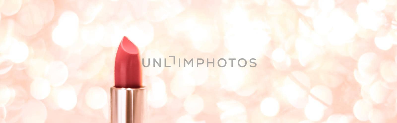 Cosmetic branding, sale and glamour concept - Coral lipstick on rose gold Christmas, New Years and Valentines Day holiday glitter background, make-up and cosmetics product for luxury beauty brand