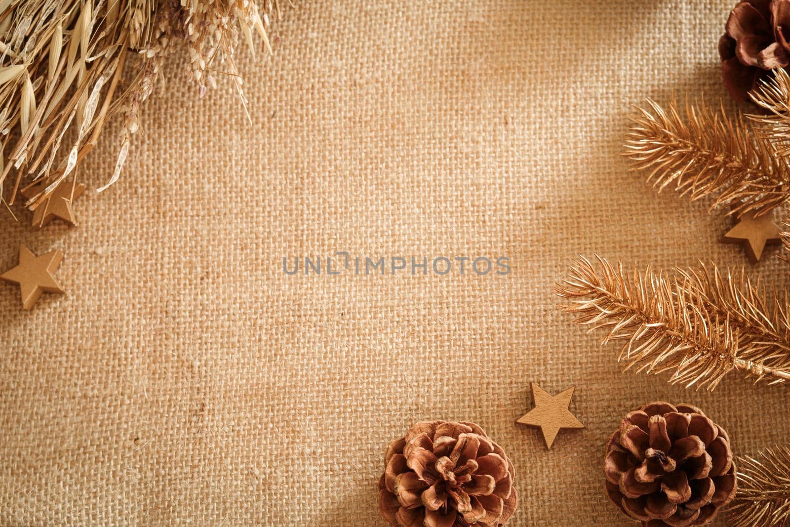 Christmas composition with natural colors and materials. Xmas background. Decoration elements, pine cones. Free space for text, copy space. Flat lay, top view. by creativebird