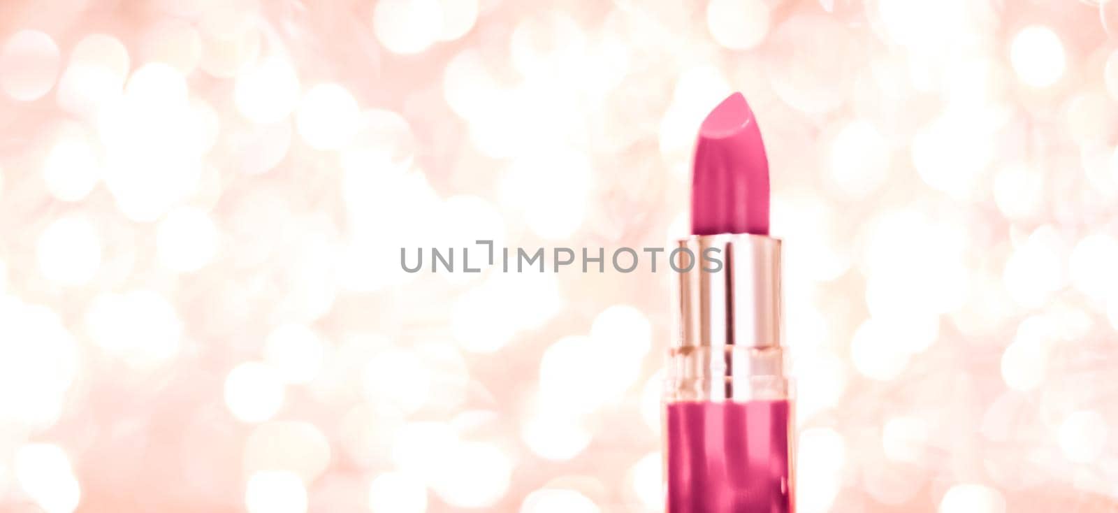 Cosmetic branding, sale and glamour concept - Pink lipstick on rose gold Christmas, New Years and Valentines Day holiday glitter background, make-up and cosmetics product for luxury beauty brand