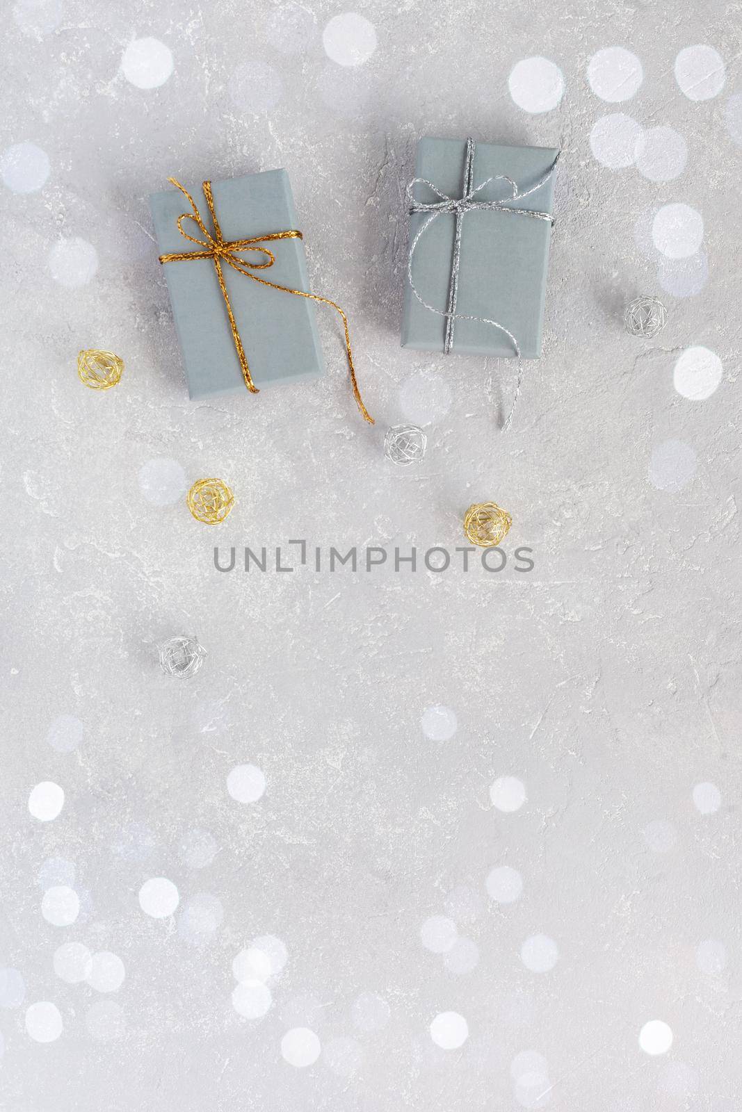 Christmas gift boxes on the grey festive background, top view, copy space