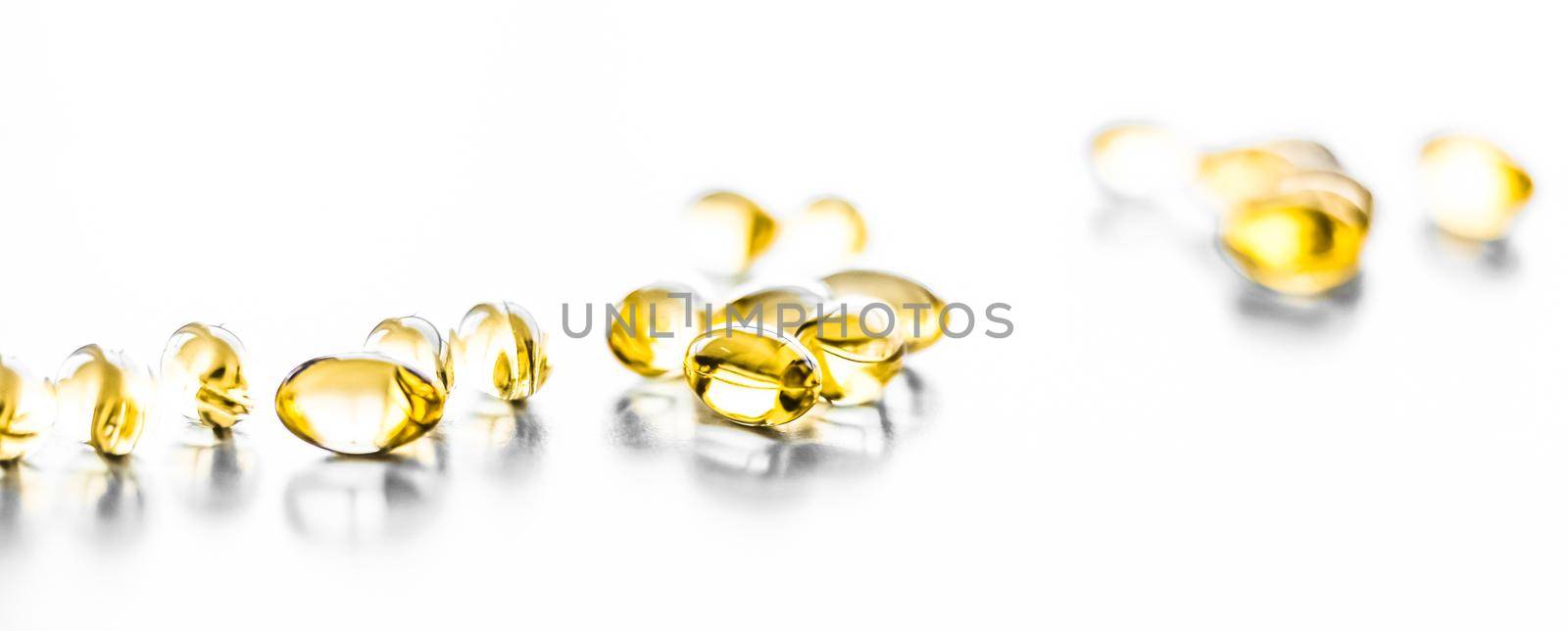 Pharmaceutical, branding and science concept - Vitamin D and golden Omega 3 pills for healthy diet nutrition, fish oil food supplement pill capsules, healthcare and medicine as pharmacy background