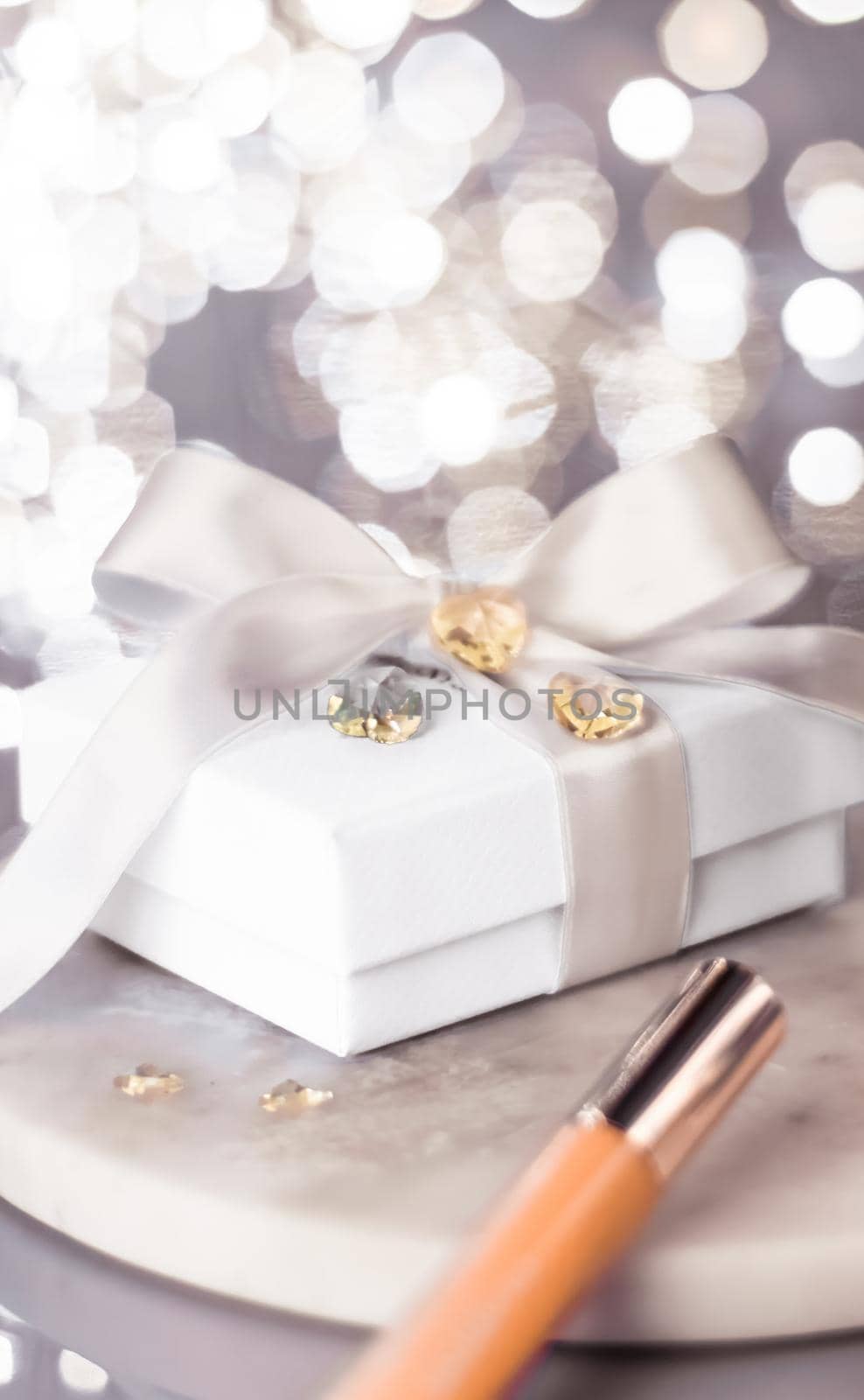 Cosmetic branding, Christmas glitter and girly blog concept - Holiday make-up foundation base, concealer and white gift box, luxury cosmetics present and blank label products for beauty brand design