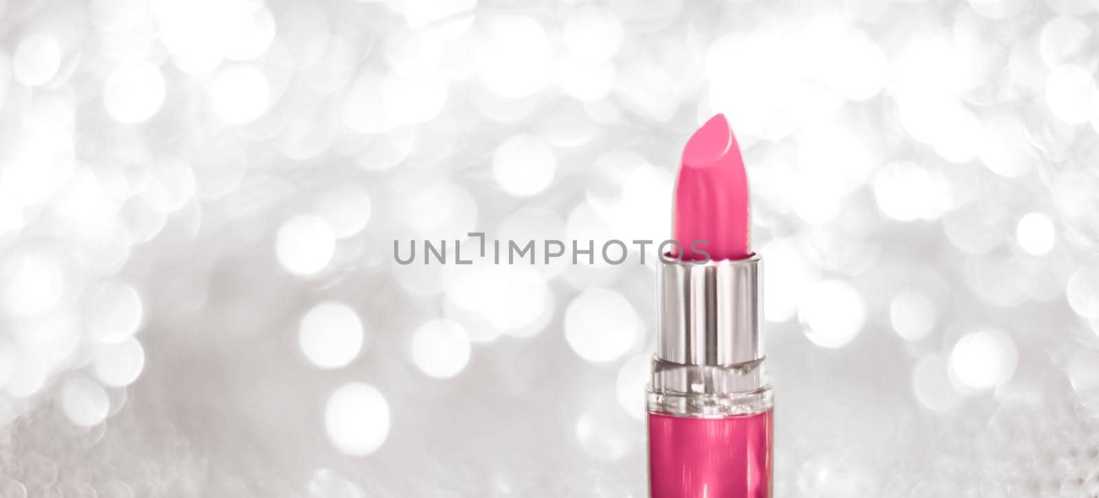 Cosmetic branding, sale and glamour concept - Pink lipstick on silver Christmas, New Years and Valentines Day holiday glitter background, make-up and cosmetics product for luxury beauty brand