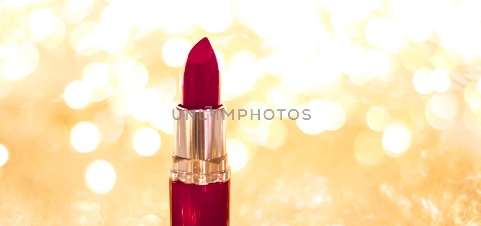 Cosmetic branding, sale and glamour concept - Dark red lipstick on golden Christmas, New Years and Valentines Day holiday glitter background, make-up and cosmetics product for luxury beauty brand