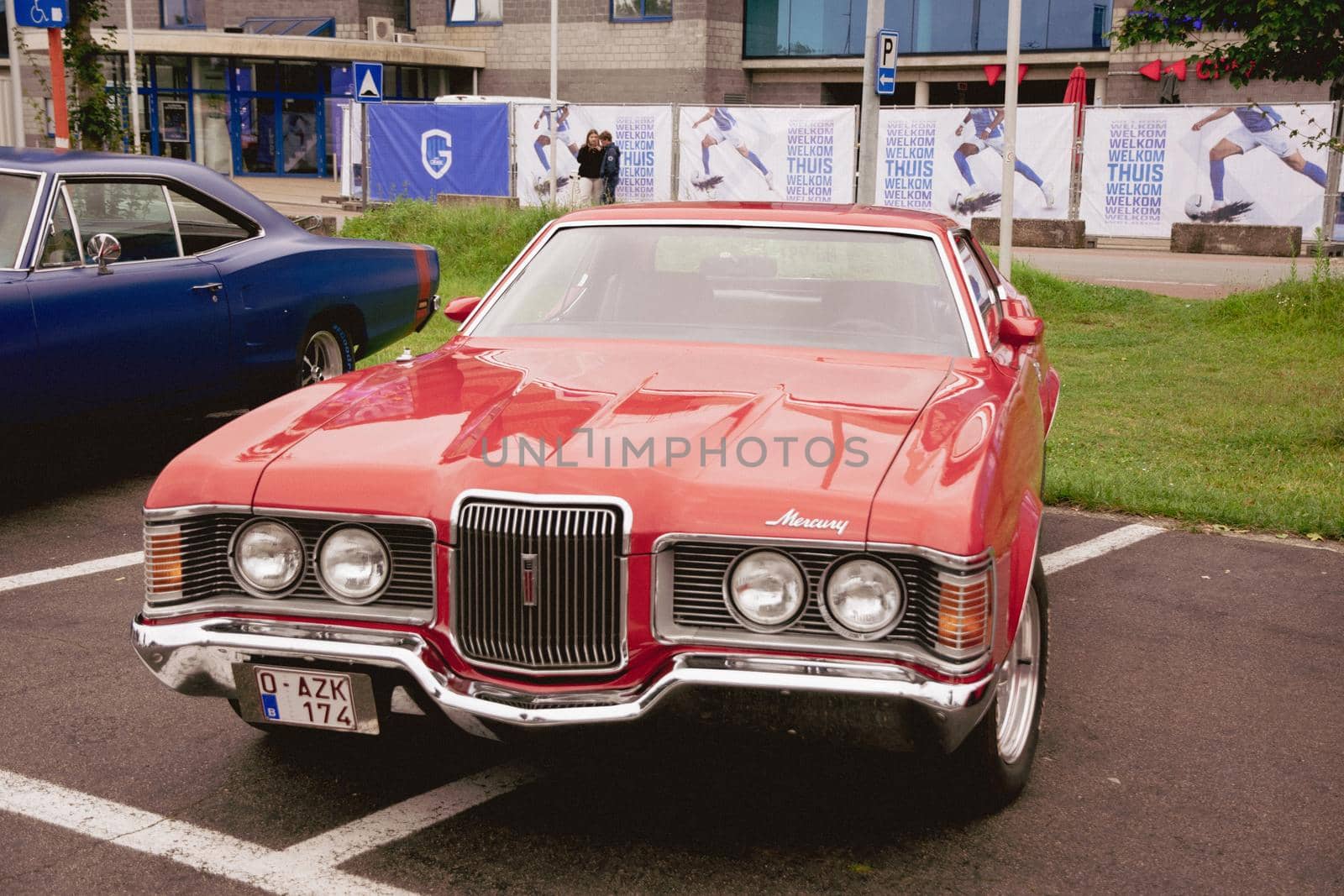 Genk, BELGIUM, August 18, 2021: classic summer meet of oldtimer at The Luminus Arena Genk, Red Ford Mercury Cougar 1968, High quality photo
