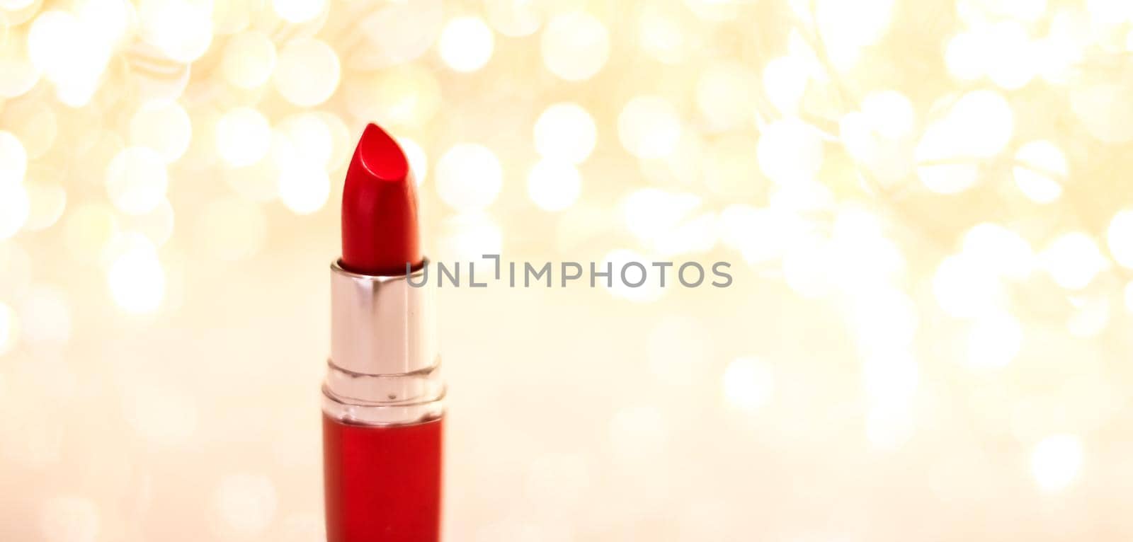 Red lipstick on golden Christmas, New Years and Valentines Day holiday glitter background, make-up and cosmetics product for luxury beauty brand by Anneleven