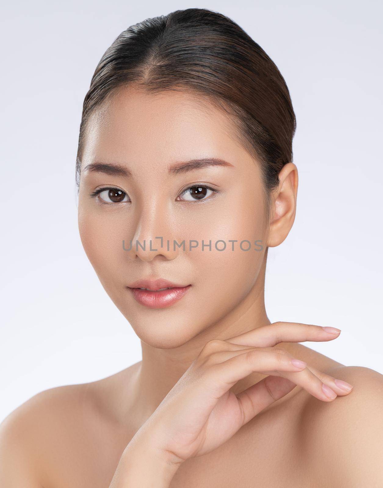 Portrait of gorgeous young girl posing beauty gesture with clean fresh skin. by biancoblue