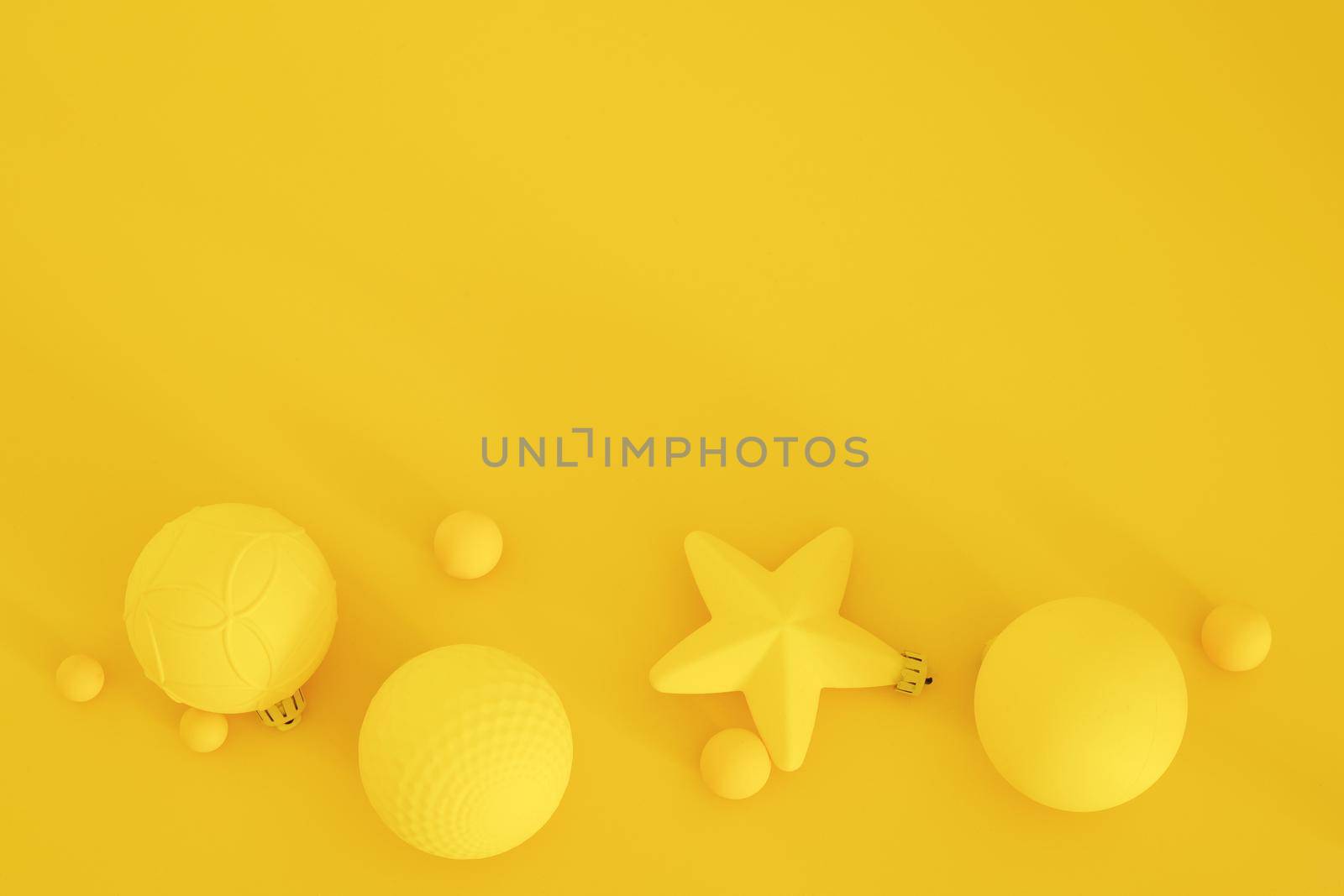 Yellow Christmas composition on the yellow background. Trendy Xmas background, mockup. Modern design. Free space for text, copy space. Flat lay, top view