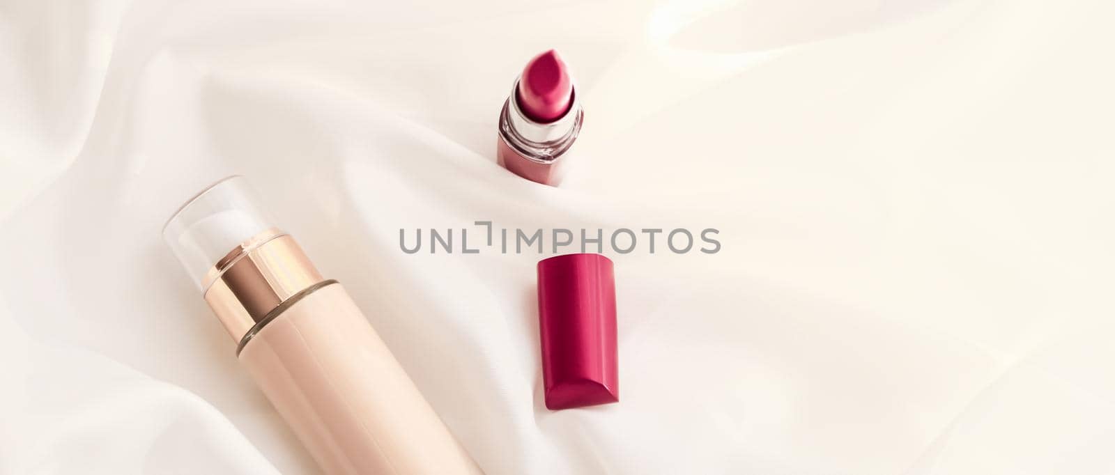 Cosmetic branding, glamour and skincare concept - Beige tonal cream bottle make-up fluid foundation base and red lipstick on silk background, cosmetics products as luxury beauty brand holiday design