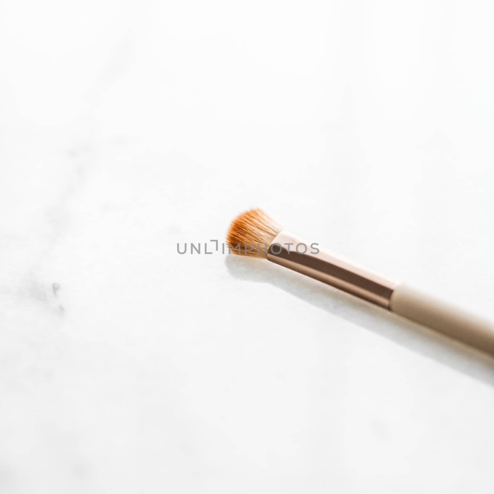 Cosmetic branding, blog and girly concept - Make-up brush for foundation base face contouring on marble background, mua cosmetics as glamour makeup artist product for luxury beauty brand art design