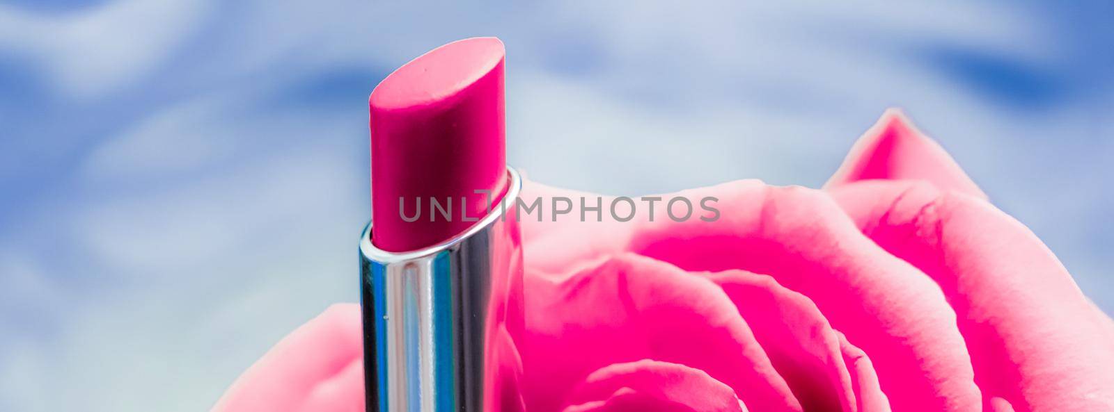 Cosmetic branding, luxe and fashion concept - Pink lipstick and rose flower on liquid background, waterproof glamour make-up and lip gloss cosmetics product for luxury beauty brand holiday design