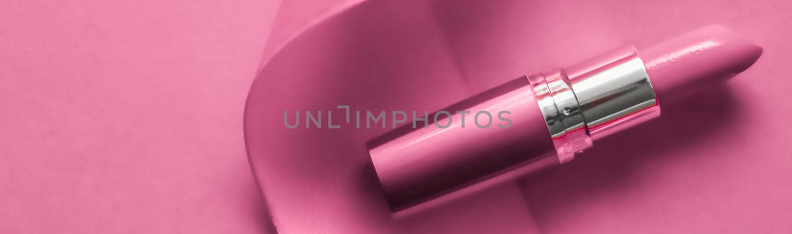 Cosmetic branding, glamour lip gloss and shopping sale concept - Luxury lipstick and silk ribbon on pink holiday background, make-up and cosmetics flatlay for beauty brand product design