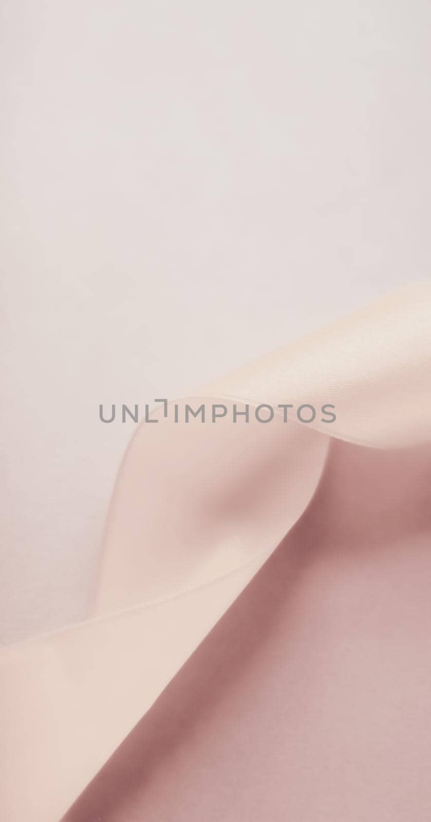 Branding, holidays and luxe brands concept - Abstract curly silk ribbon on pastel background, exclusive luxury brand design for holiday sale product promotion and glamour art invitation card backdrop