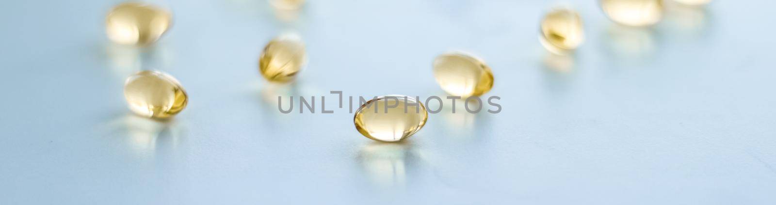 Pharmaceutical, branding and science concept - Vitamin D and golden Omega 3 pills for healthy diet nutrition, fish oil food supplement pill capsules, healthcare and medicine as pharmacy background