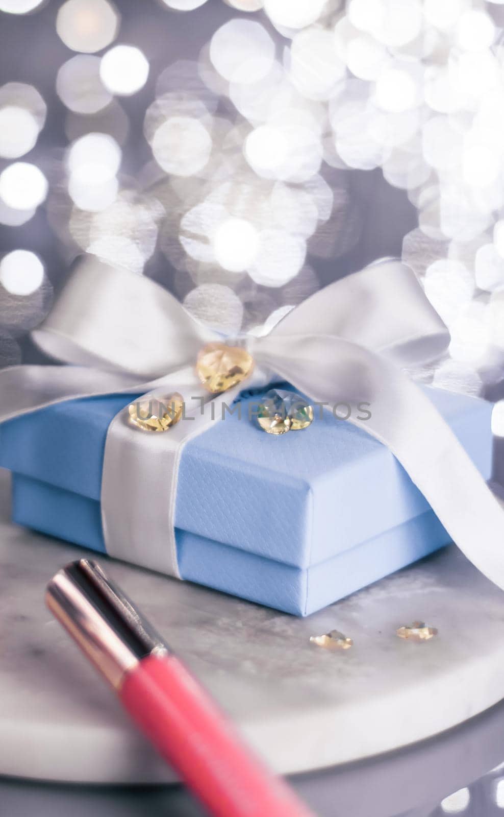 Cosmetic branding, Christmas glitter and girly blog concept - Holiday make-up foundation base, concealer and blue gift box, luxury cosmetics present and blank label products for beauty brand design