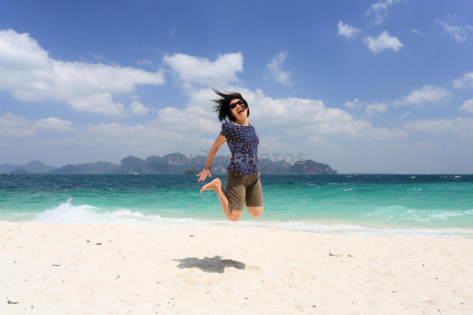 Tourist woman enjoying travel vacation at poda island, Krabi, Thailand. by toa55
