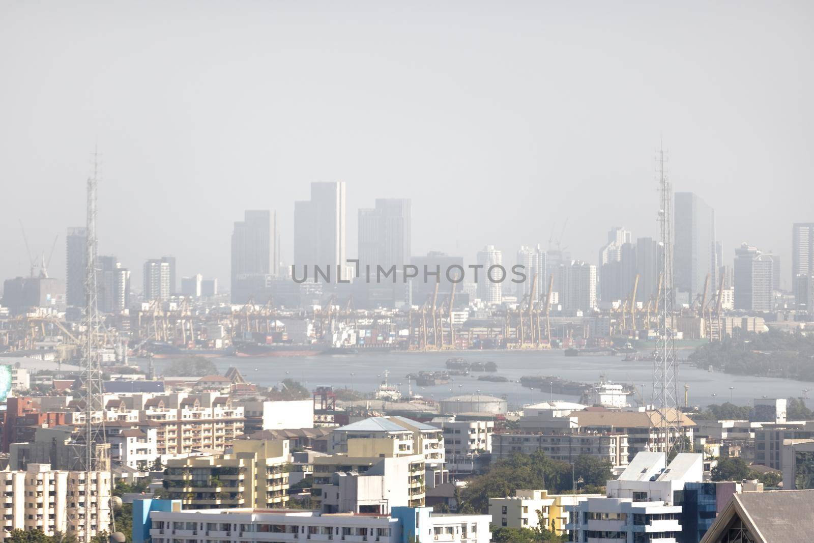 Downtown skyscrapers of the city of Bankok. Poor visibility, smog, caused by dust and smoke high level PM2.5  air pollution.