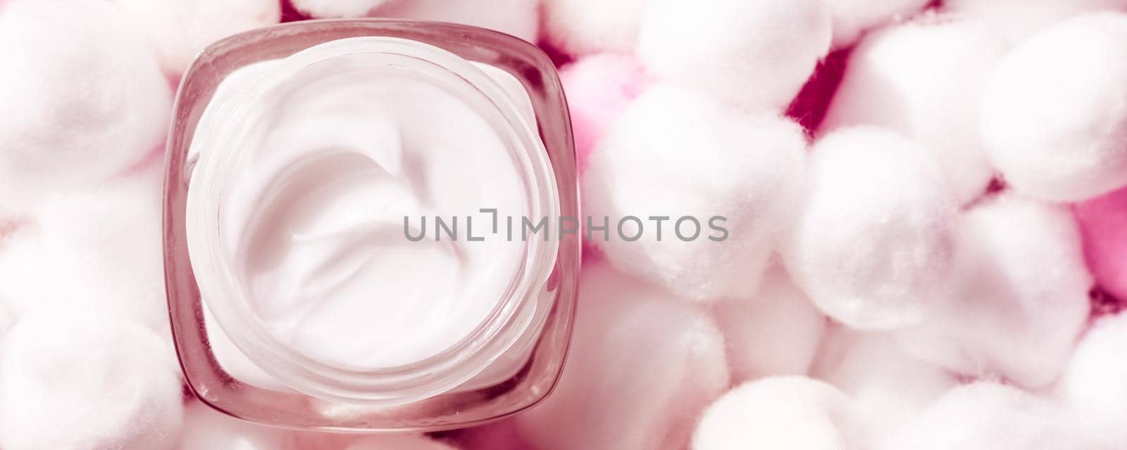 Cosmetic branding, moisturizing emulsion and facial care concept - Luxury face cream for sensitive skin and pink cotton balls on background, spa cosmetics and natural skincare beauty brand product