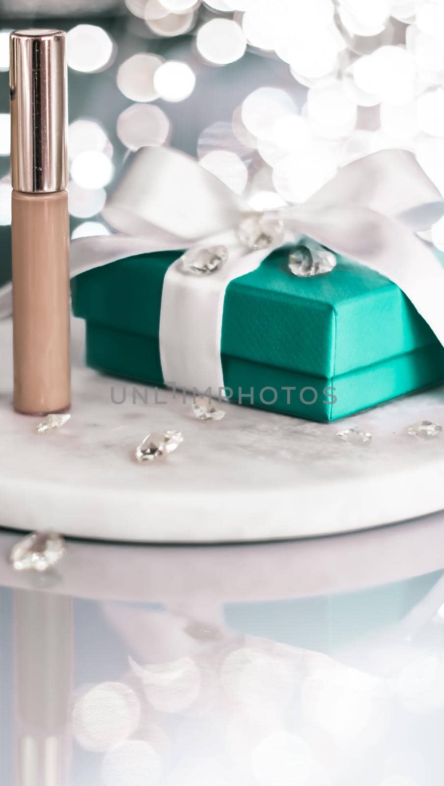 Cosmetic branding, Christmas glitter and girly blog concept - Holiday make-up foundation base, concealer and green gift box, luxury cosmetics present and blank label products for beauty brand design