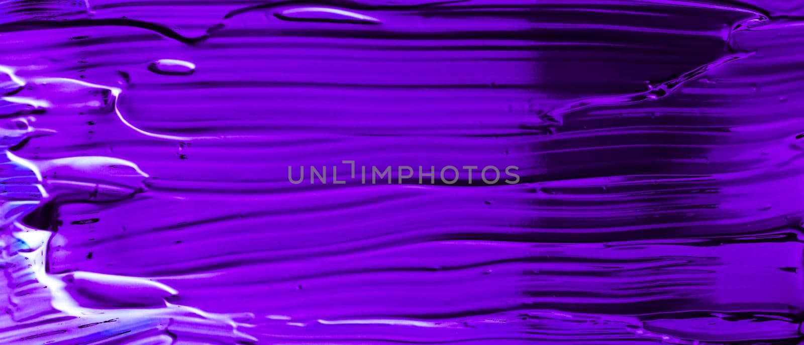 Art abstract, cosmetic product and hand painted design concept - Purple neon paint brush stroke texture isolated on black background