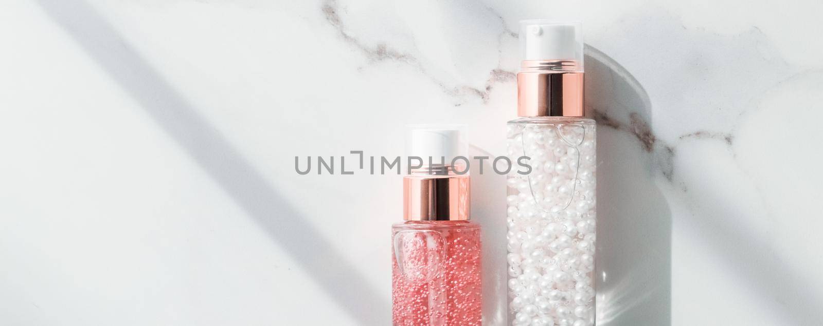 Cosmetic branding, packaging and make-up concept - Skin care serum and gel bottle, moisturizing lotion and lifting cream emulsion on marble, anti-age cosmetics for luxury beauty skincare brand design