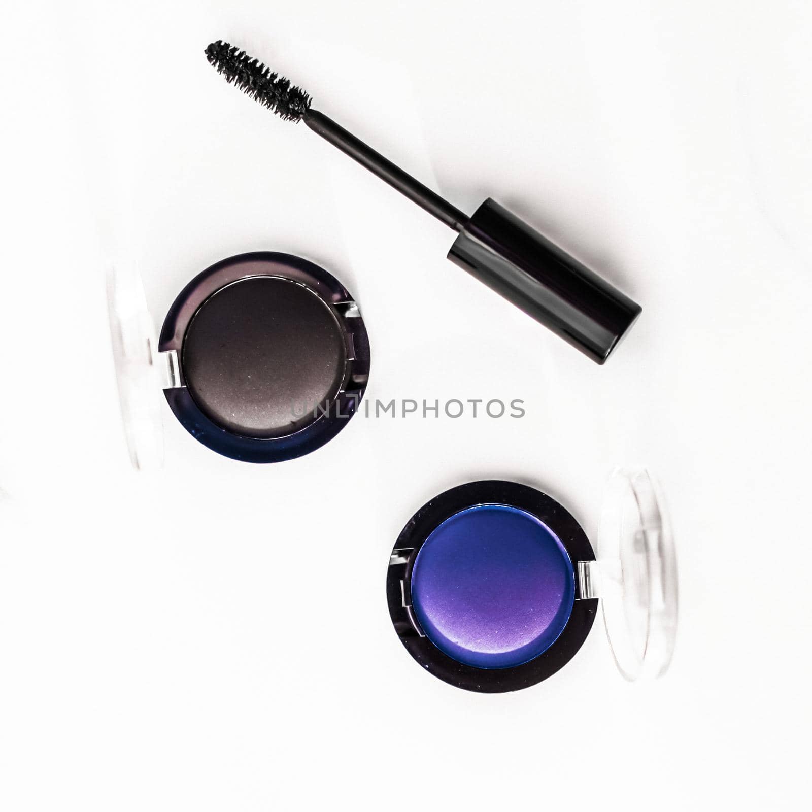 Eyeshadows, black liner and mascara on marble background, eye shadows cosmetics as glamour make-up products for luxury beauty brand, holiday flatlay design by Anneleven