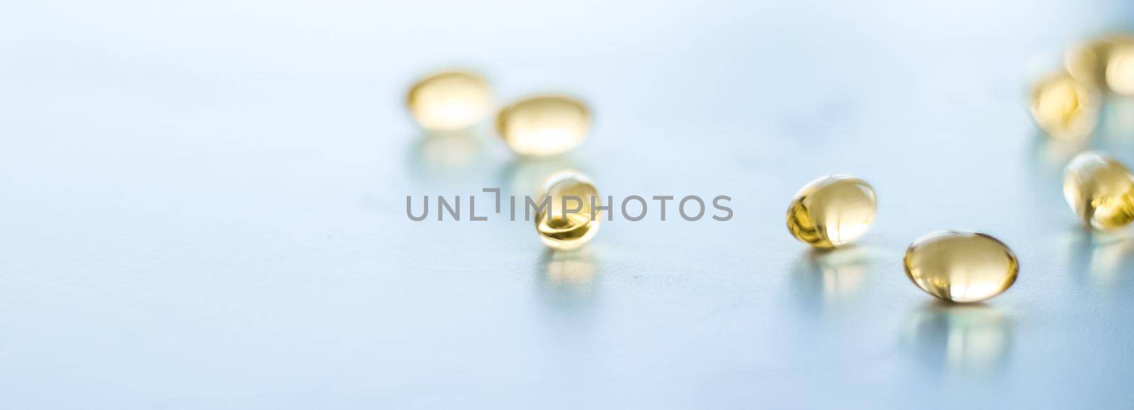 Pharmaceutical, branding and science concept - Vitamin D and golden Omega 3 pills for healthy diet nutrition, fish oil food supplement pill capsules, healthcare and medicine as pharmacy background