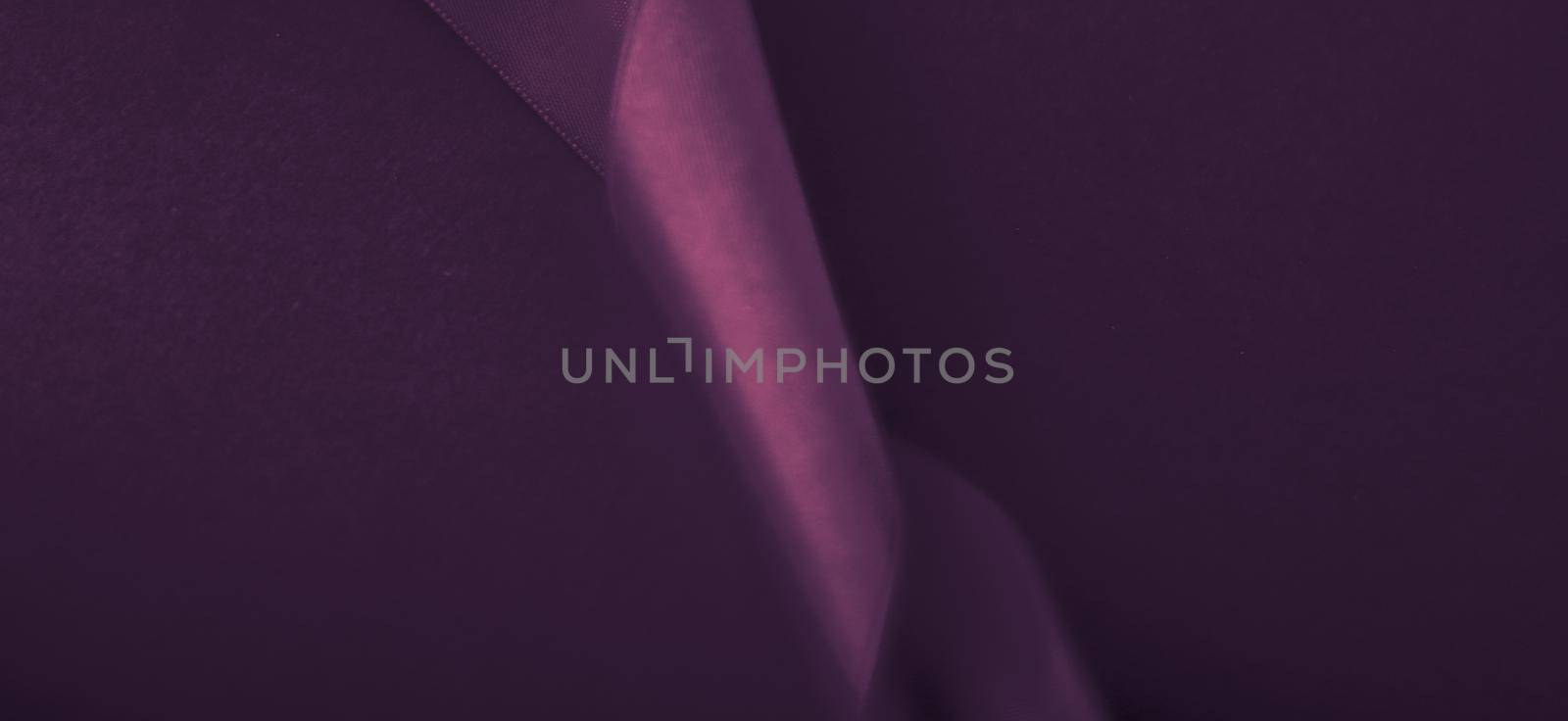 Branding, holidays and luxe brands concept - Abstract curly silk ribbon on purple background, exclusive luxury brand design for holiday sale product promotion and glamour art invitation card backdrop