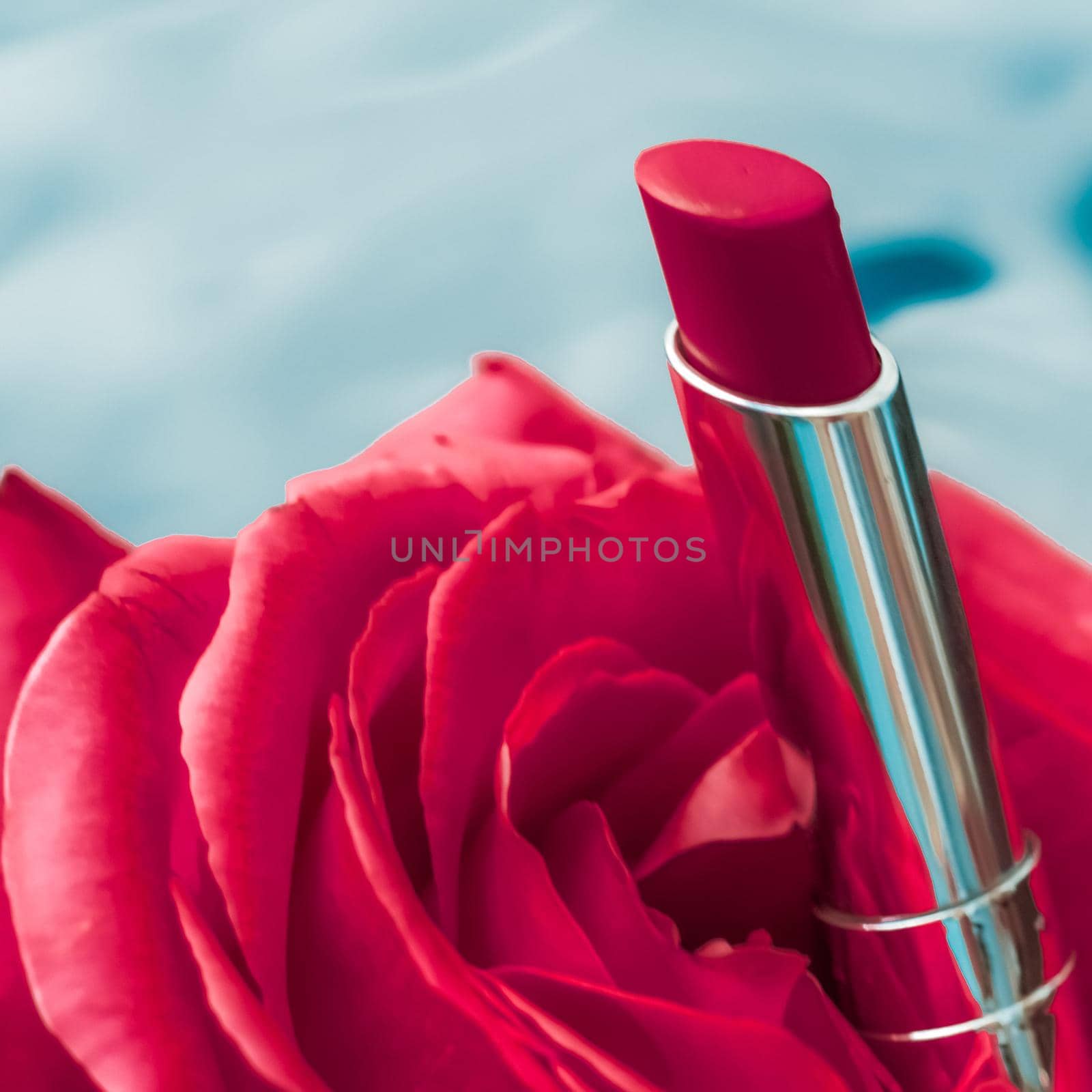 Red lipstick and rose flower on liquid background, waterproof glamour make-up and lip gloss cosmetics product for luxury beauty brand holiday design by Anneleven
