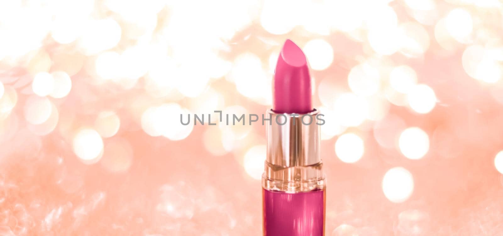 Pink lipstick on rose gold Christmas, New Years and Valentines Day holiday glitter background, make-up and cosmetics product for luxury beauty brand by Anneleven