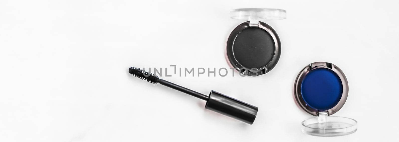 Cosmetic branding, blog and girly concept - Eyeshadows, black liner and mascara on marble background, eye shadows cosmetics as glamour make-up products for luxury beauty brand, holiday flatlay design