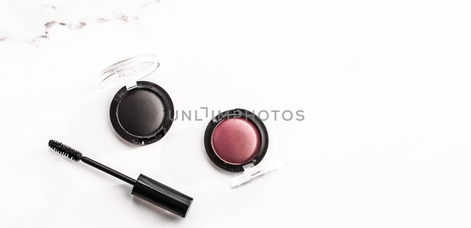Cosmetic branding, blog and girly concept - Eyeshadows, black liner and mascara on marble background, eye shadows cosmetics as glamour make-up products for luxury beauty brand, holiday flatlay design