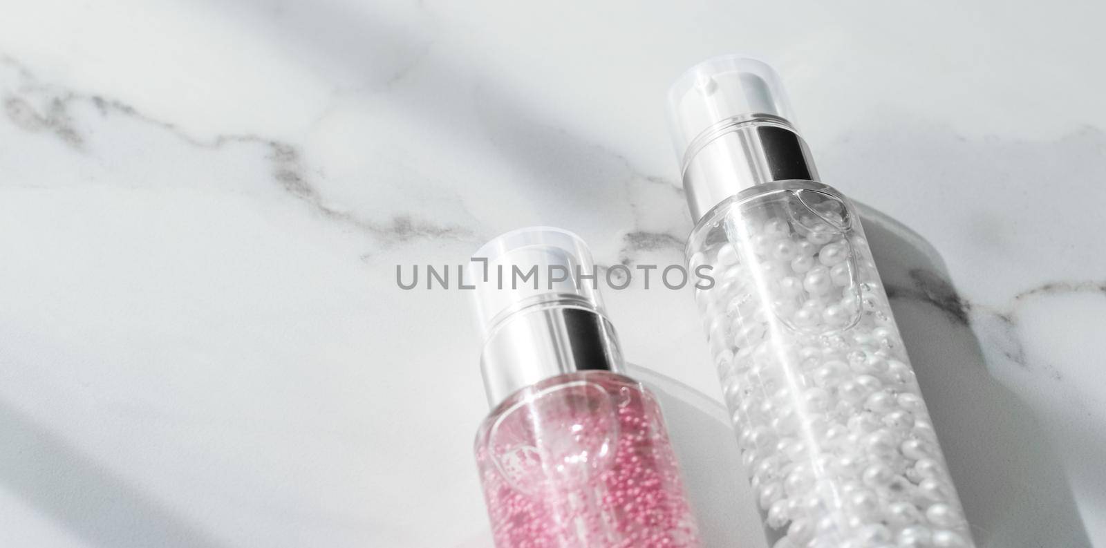 Cosmetic branding, packaging and make-up concept - Skin care serum and gel bottle, moisturizing lotion and lifting cream emulsion on marble, anti-age cosmetics for luxury beauty skincare brand design