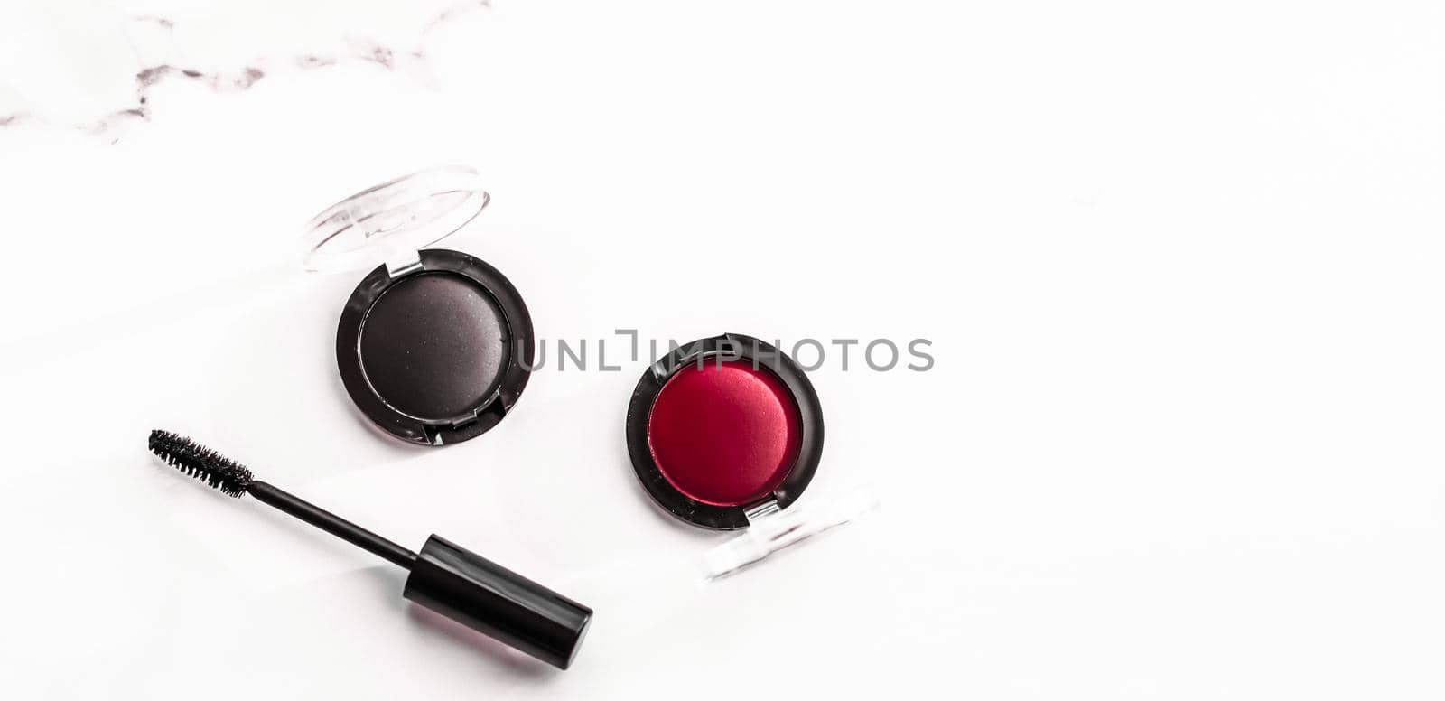 Cosmetic branding, blog and girly concept - Eyeshadows, black liner and mascara on marble background, eye shadows cosmetics as glamour make-up products for luxury beauty brand, holiday flatlay design