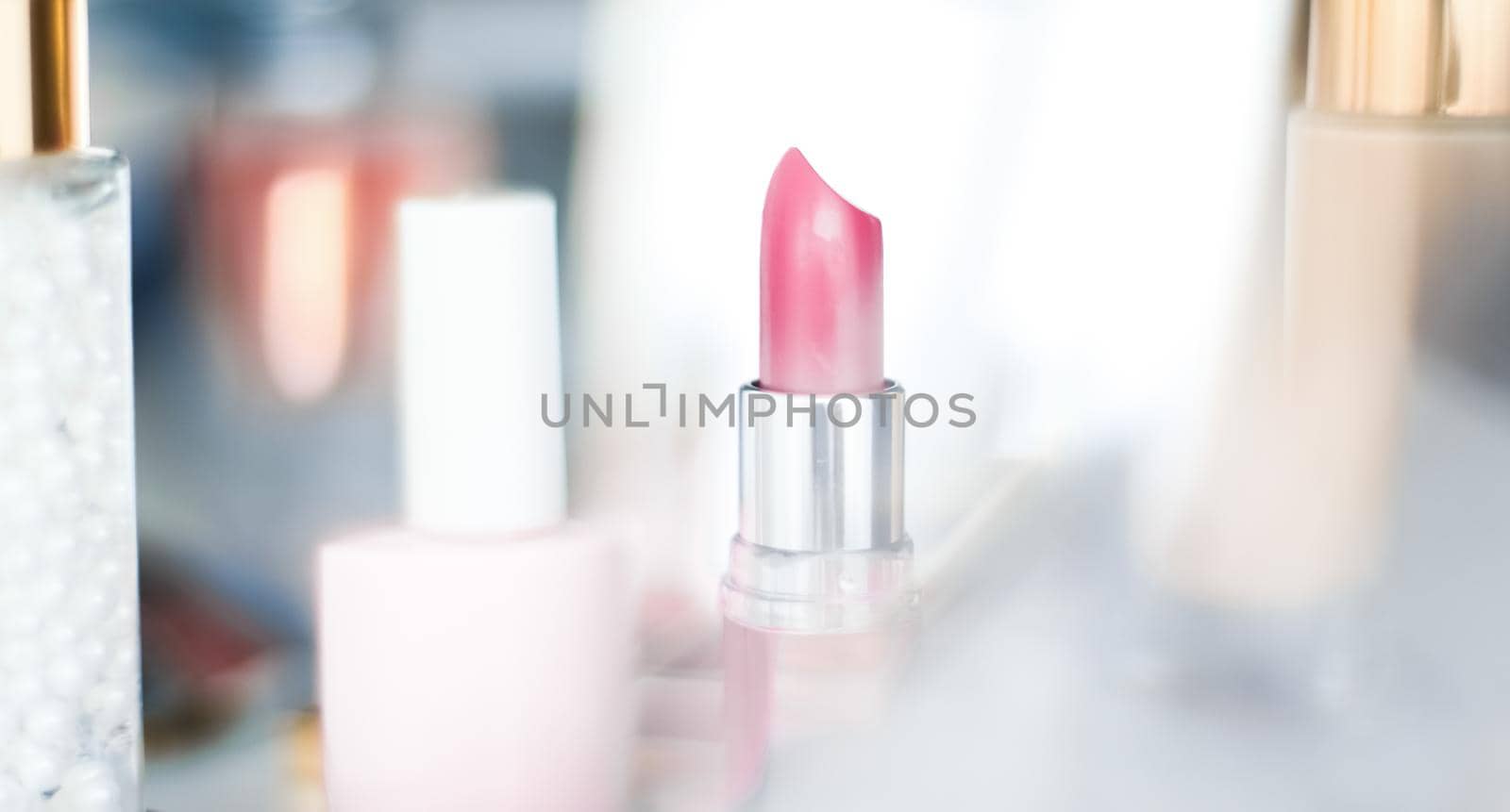 Cosmetic branding, girly and glamour concept - Cosmetics, makeup products on dressing vanity table, lipstick, foundation base, nailpolish and eyeshadows for luxury beauty and fashion brand ads design