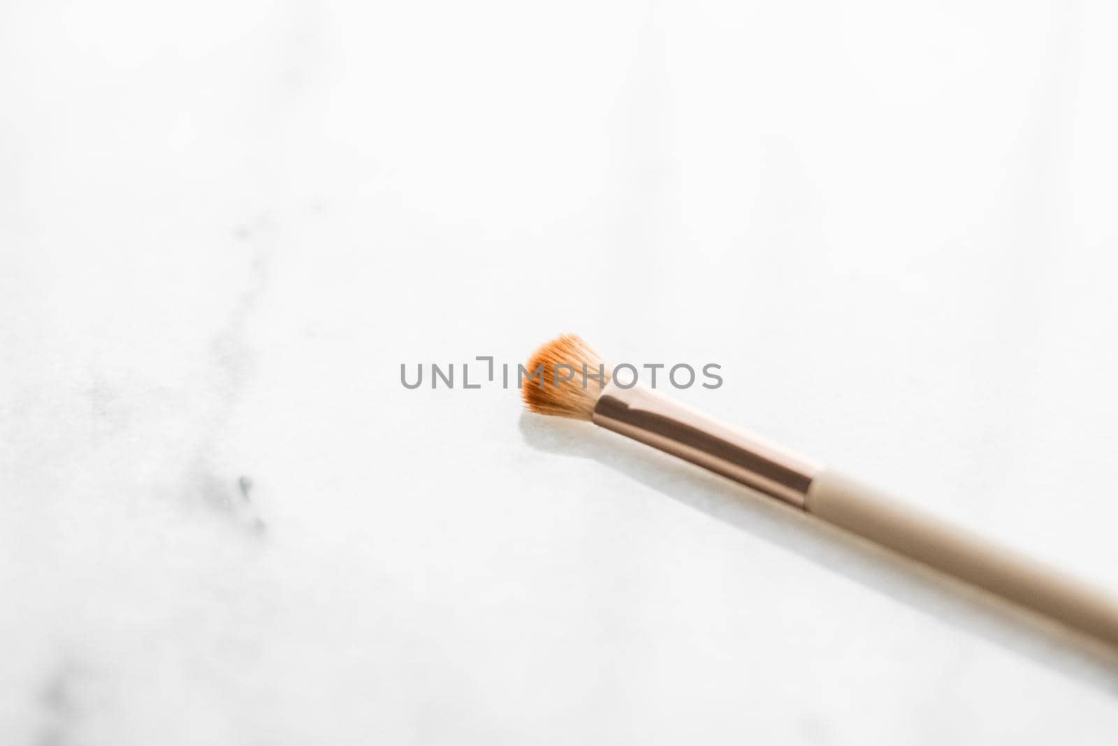 Cosmetic branding, blog and girly concept - Make-up brush for foundation base face contouring on marble background, mua cosmetics as glamour makeup artist product for luxury beauty brand art design