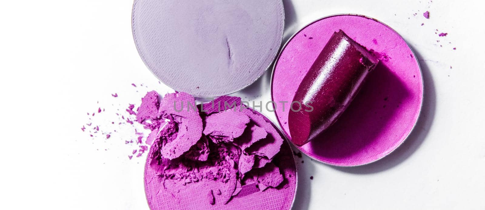 Beauty texture, cosmetic product and art of make-up concept - Crushed eyeshadows and lipstick isolated on white background