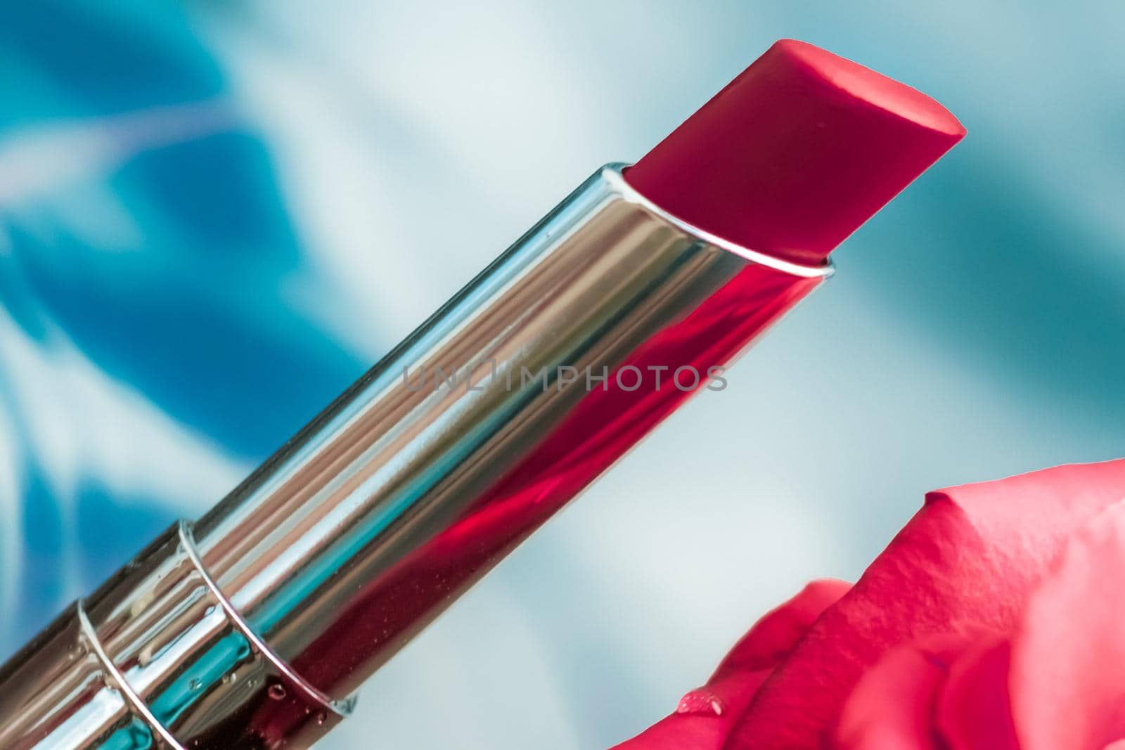 Cosmetic branding, luxe and fashion concept - Red lipstick and rose flower on liquid background, waterproof glamour make-up and lip gloss cosmetics product for luxury beauty brand holiday design