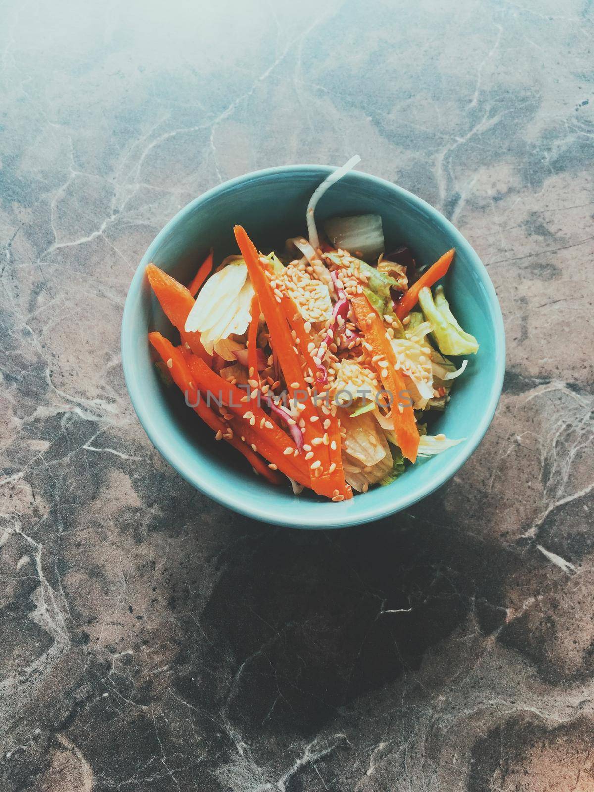 Vegan dieting, eating out and oriental cuisine concept - Vegetarian asian vegetable salad served in a bowl in japanese restaurant, healthy diet food