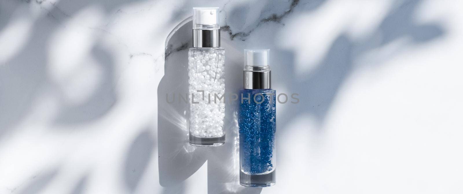 Cosmetic branding, packaging and make-up concept - Skin care serum and gel bottle, moisturizing lotion and lifting cream emulsion on marble, anti-age cosmetics for luxury beauty skincare brand design