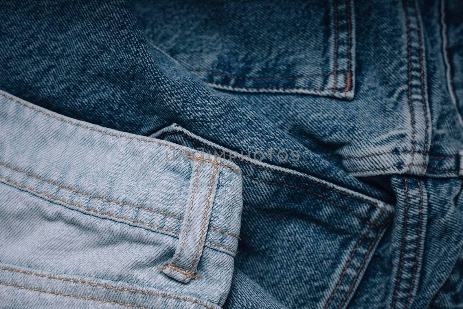 Jeans texture. Highly detailed closeup of blue jeans. Cool background.