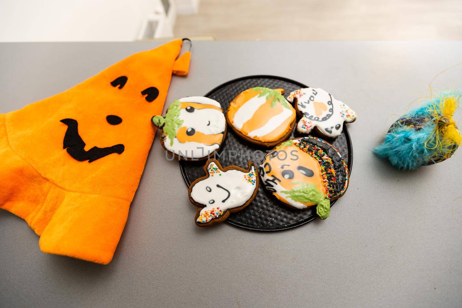 Master class for children on baking funny halloween cookies. Young children learn to cook a funny monster cookies. Kids preparing homemade cookies. Little cook. by Andelov13