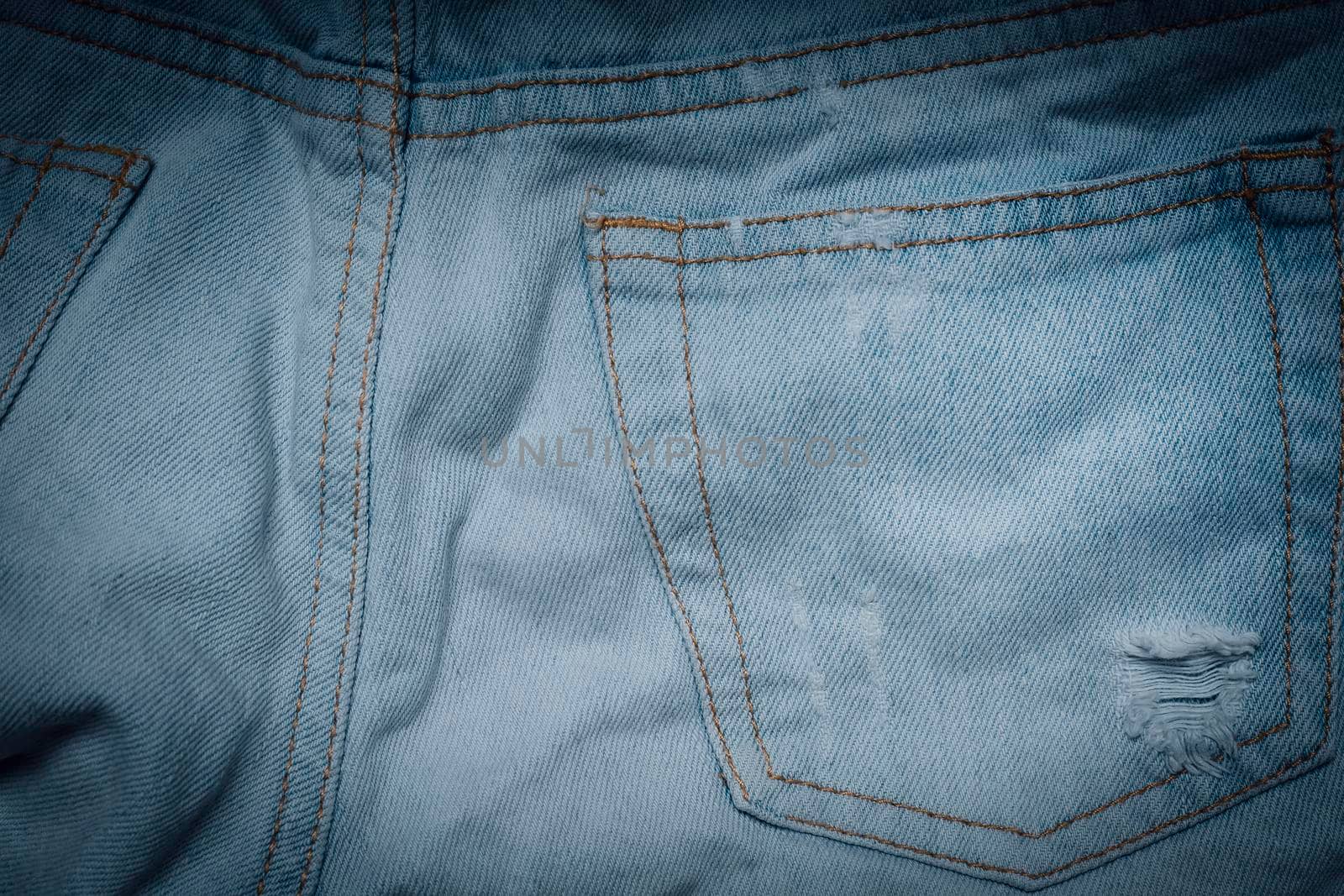 Jeans texture with pocket. Highly detailed closeup of blue jeans. Cool background. by creativebird